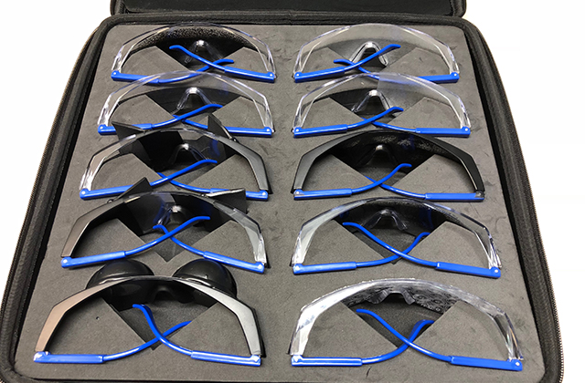 Image of a set of 10 goggles that simulate visual impairments in a case